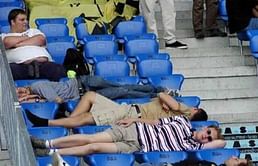 Wigan fans sunbathing in the stands