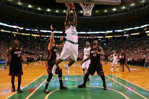 Boston Celtics' Brandon Bass attempts a dunk during the first half of game four