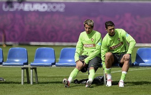 Portugal&#039;s defender Fabio Coentrao (L) and forward Cristiano Ronaldo