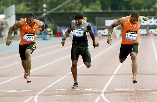 Yohan Blake of Jamaica (L) wins the Men&#039;s 100m A group