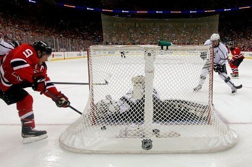 Devils&#039; Zach Parise (L) scored 12:45 into the first when Jonathan Quick mishandled the puck at the side of his net