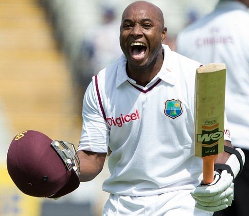 Tino Best celebrates making 50 runs on Sunday. He would go on to make 95