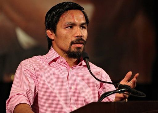 Manny Pacquiao addresses the media during the post-fight press conference