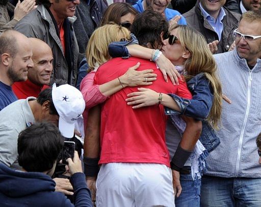 Nadal celebrates his win with his sister (right) and mother (left)