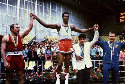 Teofilo Stevenson (centre) with a gold medal at the 1980 Moscow Olympics