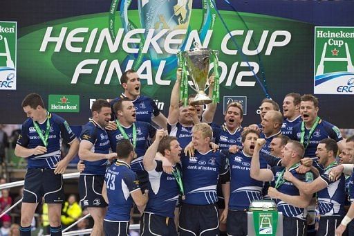 Leinster players celebrate with the trophy after their victory in the European Cup final on May 19