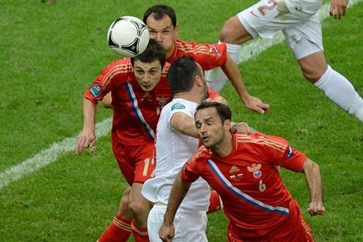 Russian midfielder Alan Dzagoev (L) scores a goal