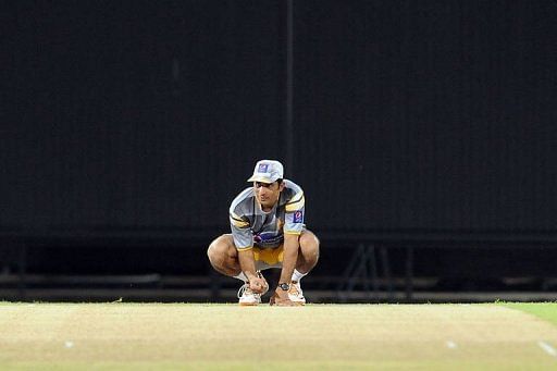 Pakistan captain Misbah-ul-Haq inspects the pitch during a practice session in Colombo Tuesday
