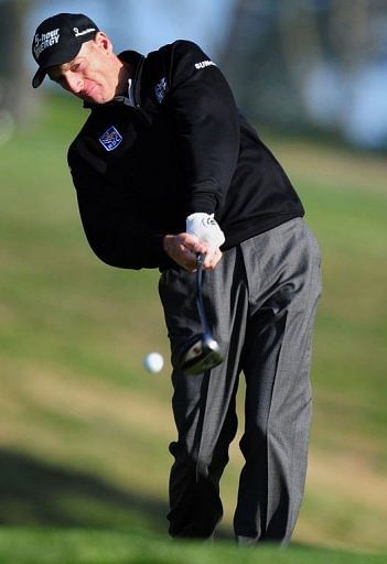 Jim Furyk of the US tees off at the 9th hole