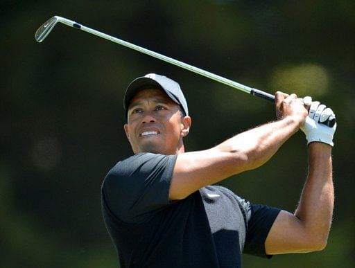 Tiger Woods of the US watches his tee shot during the second round