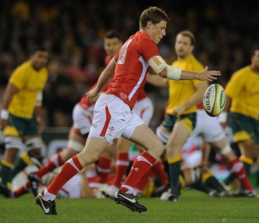 Welsh player Rhys Priestland (C) kicks the ball during the second Rugby Union Test against Australia