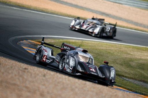 British Oliver Jarvis drives ahead of British Allan Mcnish during the 80th edition of Le Mans 24 hours endurance race.