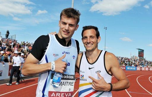 Christophe Lemaitre (L) poses with pole vaulter Renaud Lavilenie