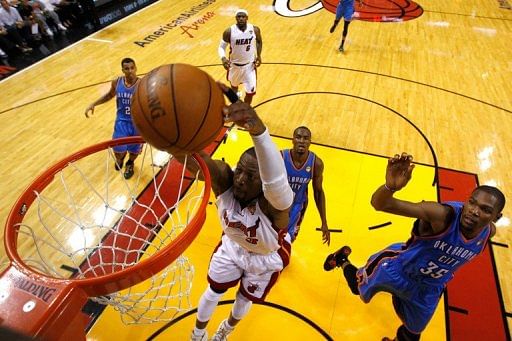 James powers Heat past Thunder for NBA lead