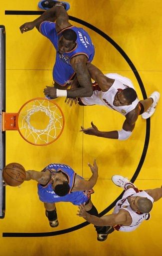 Oklahoma City Thunder Thabo Sefolosha gets off a shot against Miami Heat during the NBA Finals game