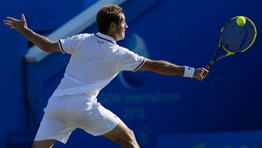 Richard Gasquet of France plays a shot to Marinko Matosevic of Austria