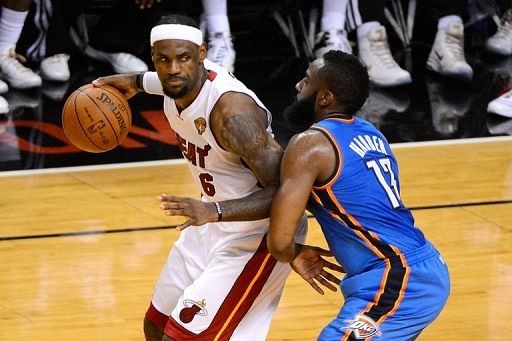 A hobbled LeBron James (L) hit the go-ahead three-pointer with 2:51 to play
