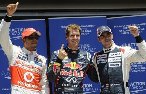 (Left to right) Lewis Hamilton, Sebastian Vettel and Pastor Maldonado after Saturday&#039;s qualifying race