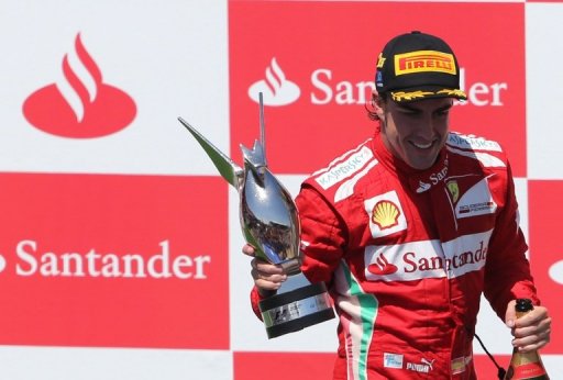 Ferrari's Fernando Alonso from Spain, right, drives his car in between the  pack during the European Formula One Grand Prix at Valencia street circuit,  Spain, Sunday, June 24, 2012. The race takes