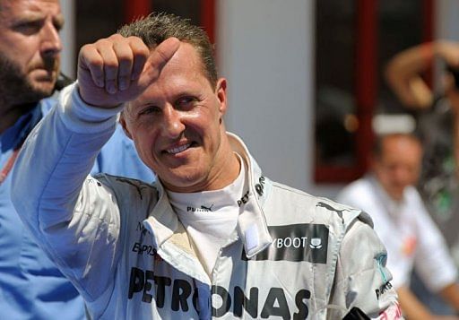 Michael Schumacher celebrates in the parc ferme