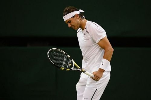 Spain's Rafael Nadal reacts after a point in the fourth set