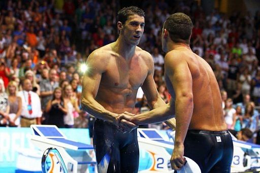 Behind Michael Phelps (L), Tyler Clary won a furious race for second place in 200m fly