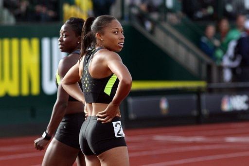 Jeneba Tarmoh (L) and Allyson Felix after competing in the women&#039;s 100m dash on June 23
