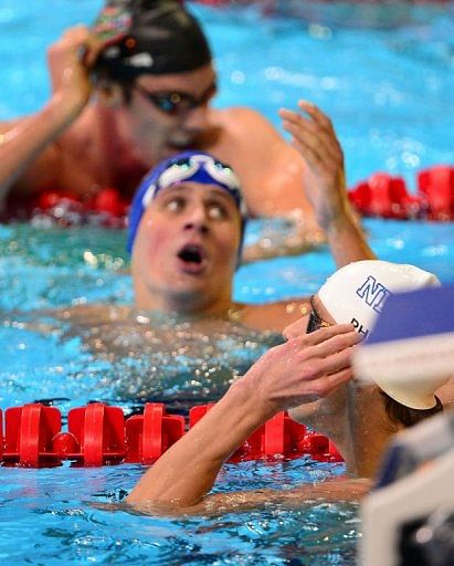 Ryan Lochte (C), who holds the world record in the 200m medley, was second in 1:54.93