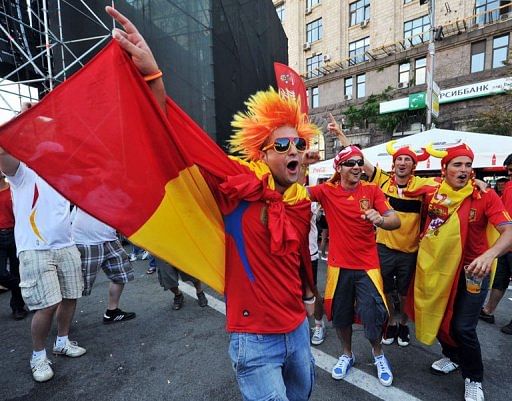 Spanish supporters cheer in the fan zone in Kiev