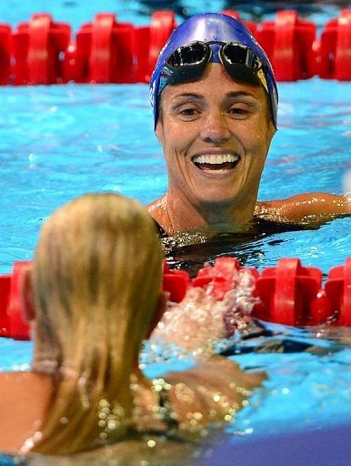 Dara Torres, 45, (top) and Jessica Hardy, 25, (bottom) congratulate each other