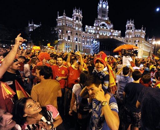 Supporters of the Spanish national football team celebrate in Madrid