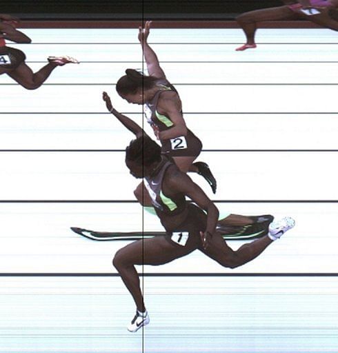 Jeneba Tarmoh and Allyson Felix (top) were given identical timings of 11.068 seconds in the race