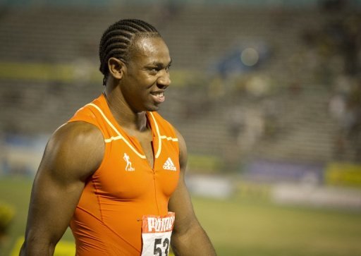 Yohan Blake smiles after winning the men&#039;s 200m final at the Jamaican Olympic Athletic Trials