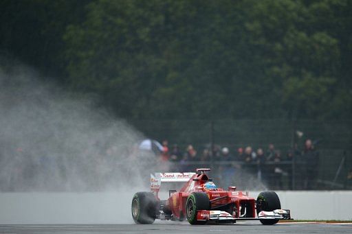 Alonso clocked a best time of one minute and 32.167 seconds in intermittent sunshine at a sodden Silverstone