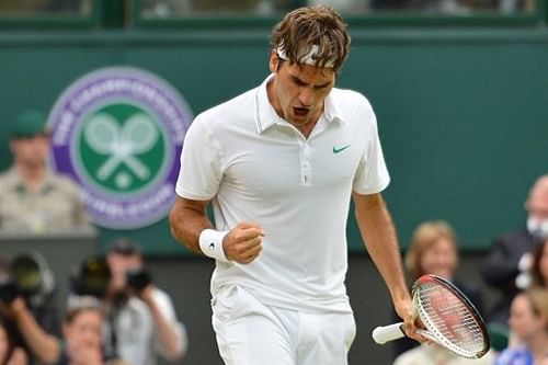 Switzerland's Roger Federer reacts to breaking serve in the fourth set