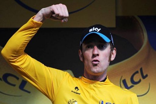 Bradley Wiggins celebrates on the podium