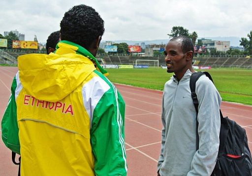 Ethiopian 10,000 meter runner, Ibrahim Jelan (R), pictured after practice in Addis Ababa