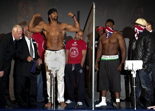 British boxers David Haye (L) and Dereck Chisora take part in a weigh-in
