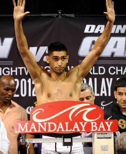 Amir Khan, 26-2 with 18 knockouts, will defend the World Boxing Association title he was given earlier this week