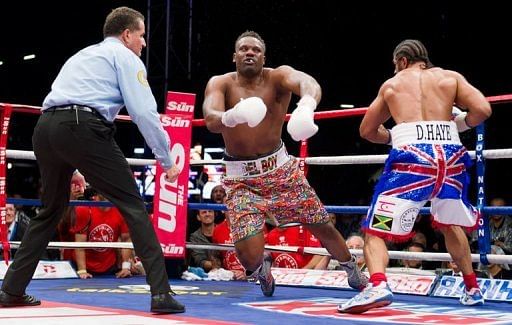 Dereck Chisora falls to the canvas after David Haye lands a final punch