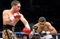 Beaten Amir Khan vows to box on
