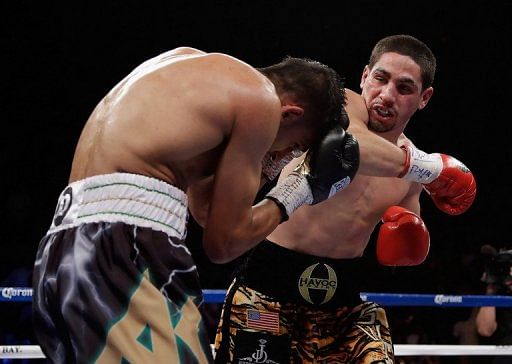 Danny Garcia (right) stopped Amir Khan (left) in the fourth round of the fight