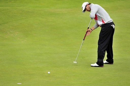 Adam Scott of Australia putting on the 13th green