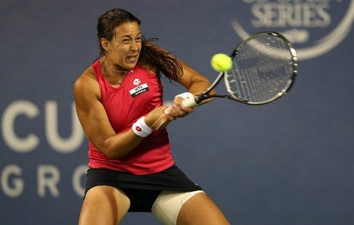 Marion Bartoli competed with a thigh strapping after suffering an injury in her match the day before