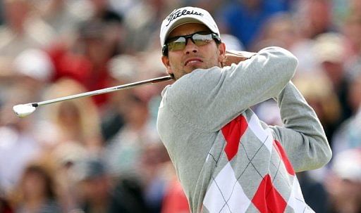 Adam Scott of Australia watches his shot from the 5th tee