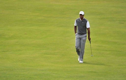 Tiger Woods of the US walks to the 2nd green