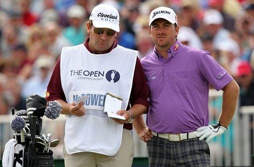 Graeme McDowell (R) of Northern Ireland looks on from the 5th tee