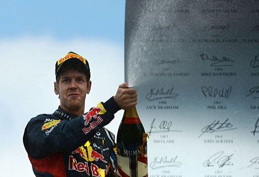 Red Bull Racing&#039;s German driver Sebastian Vettel celebrates on the podium