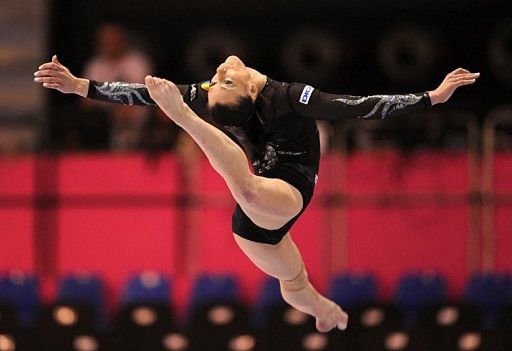 Romania&#039;s Catalina Ponor performs on the balance beam in Brussels in May