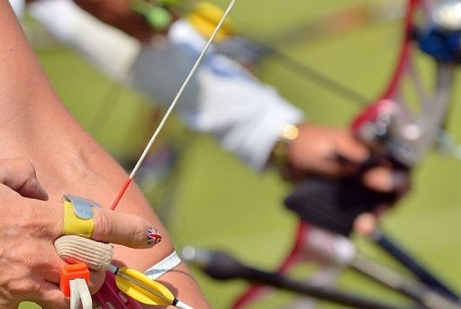 British archer Allison Willamson prepares to take a shot during a practice session at Lord&#039;s